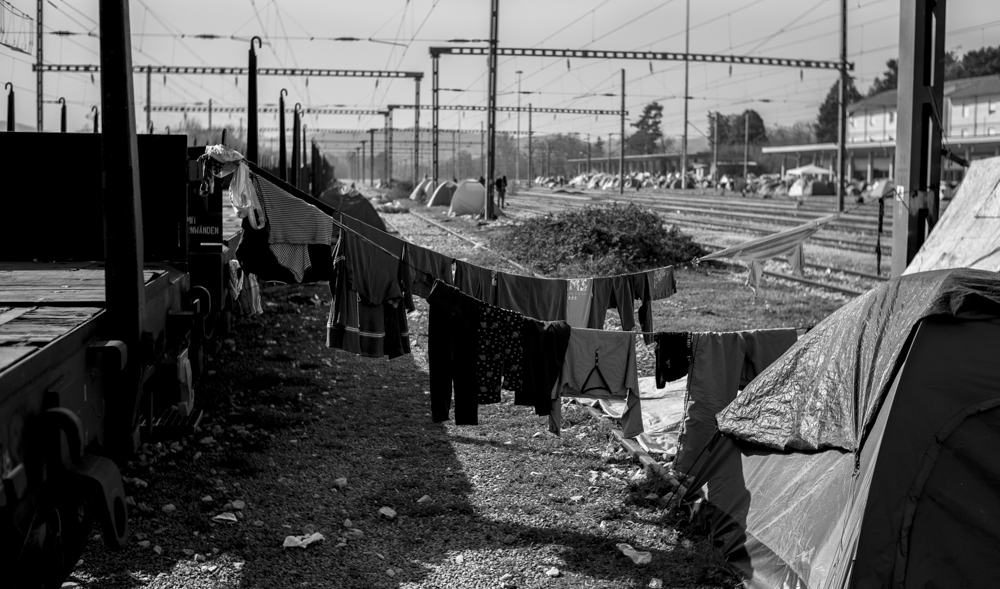 Clothes hang out to dry on the train tracks.
