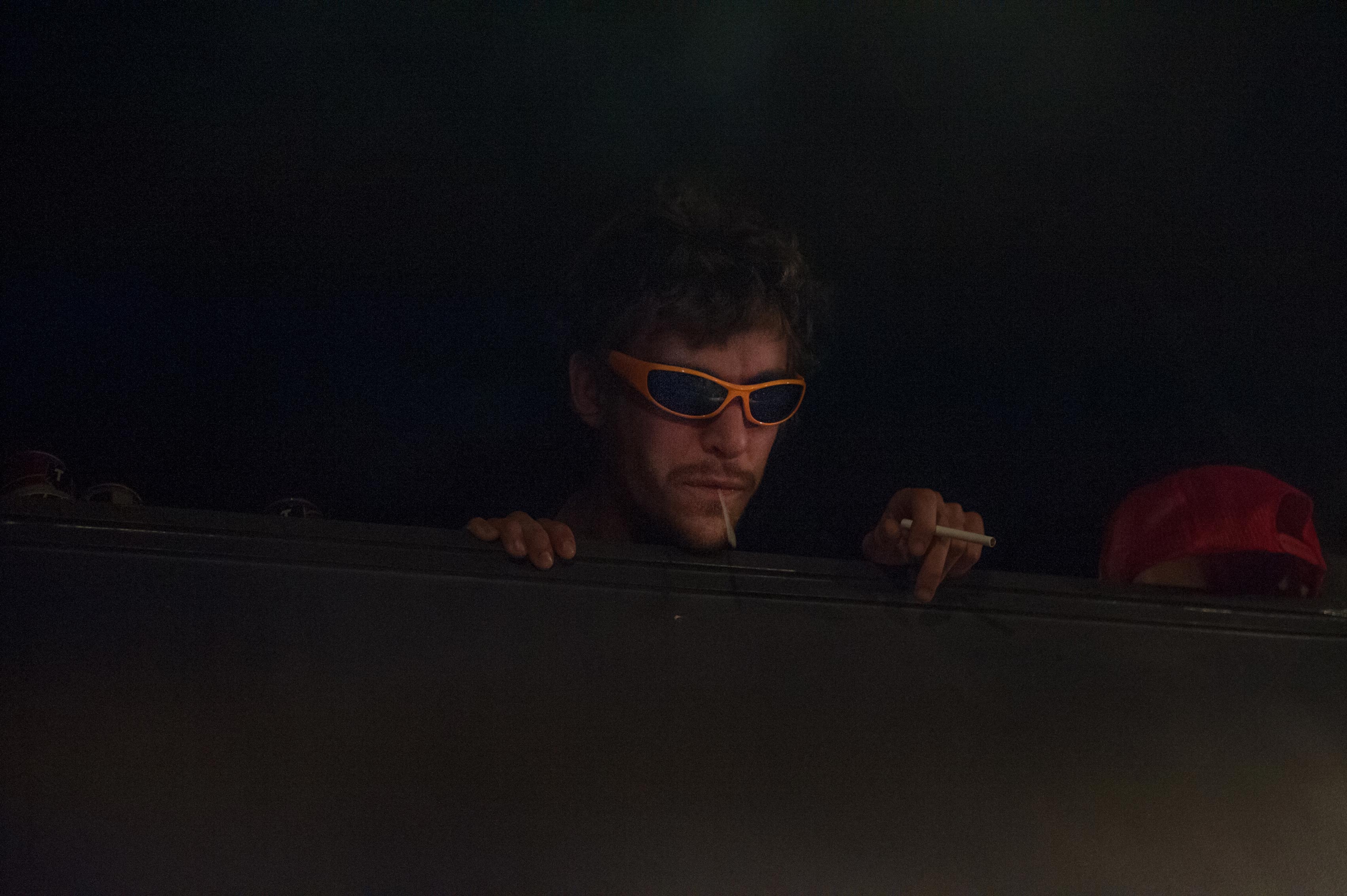 Saul Adamczewski, guitarist, peers out from the loft a greenroom, Washington Dc.