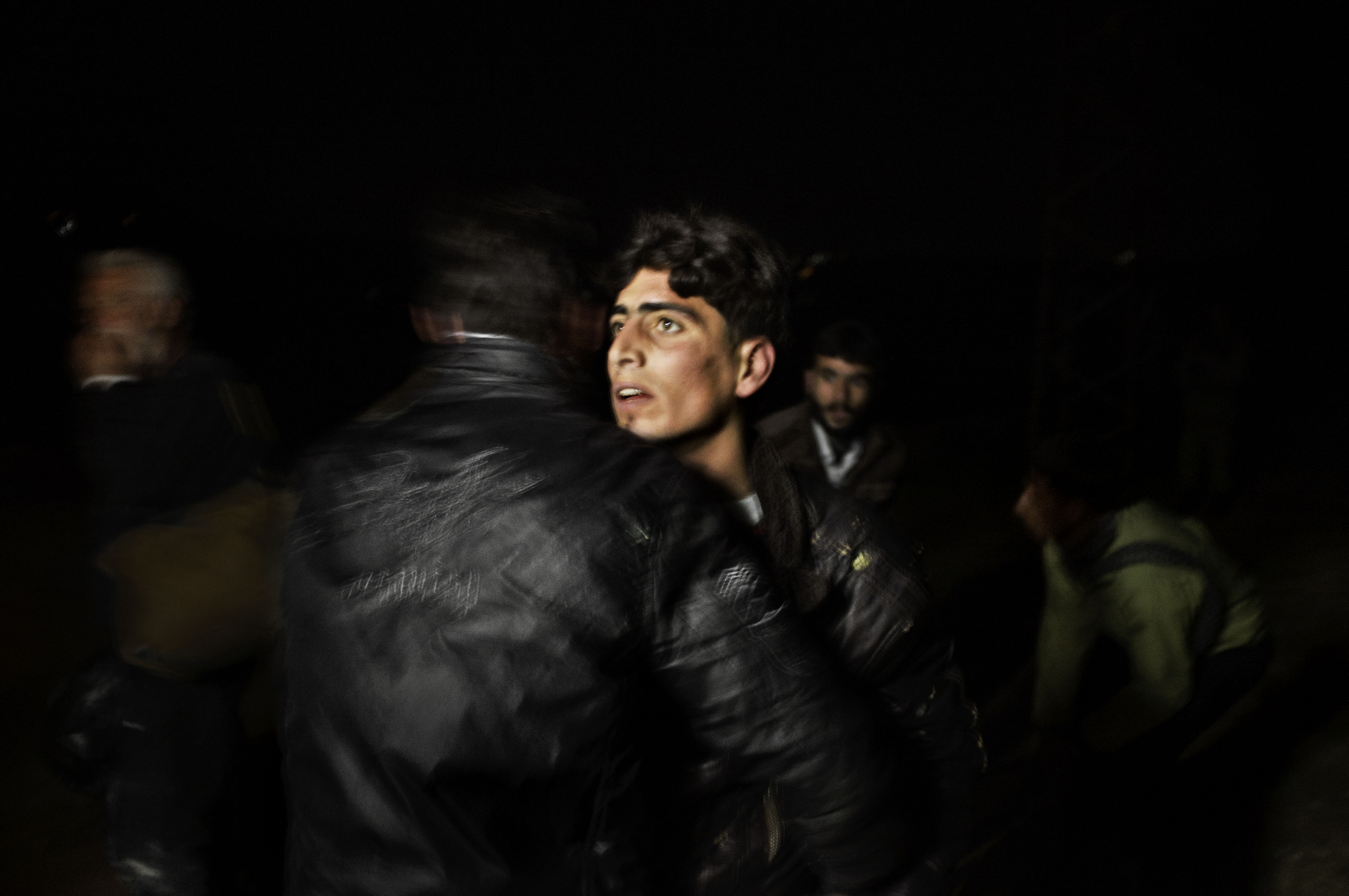 Along the Turkey-Syria border. March, 2012. Syrian refugees arrive inside Turkish territory under the cover of night after being smuggled from in from Syria. © Moises Saman / Magnum Photos