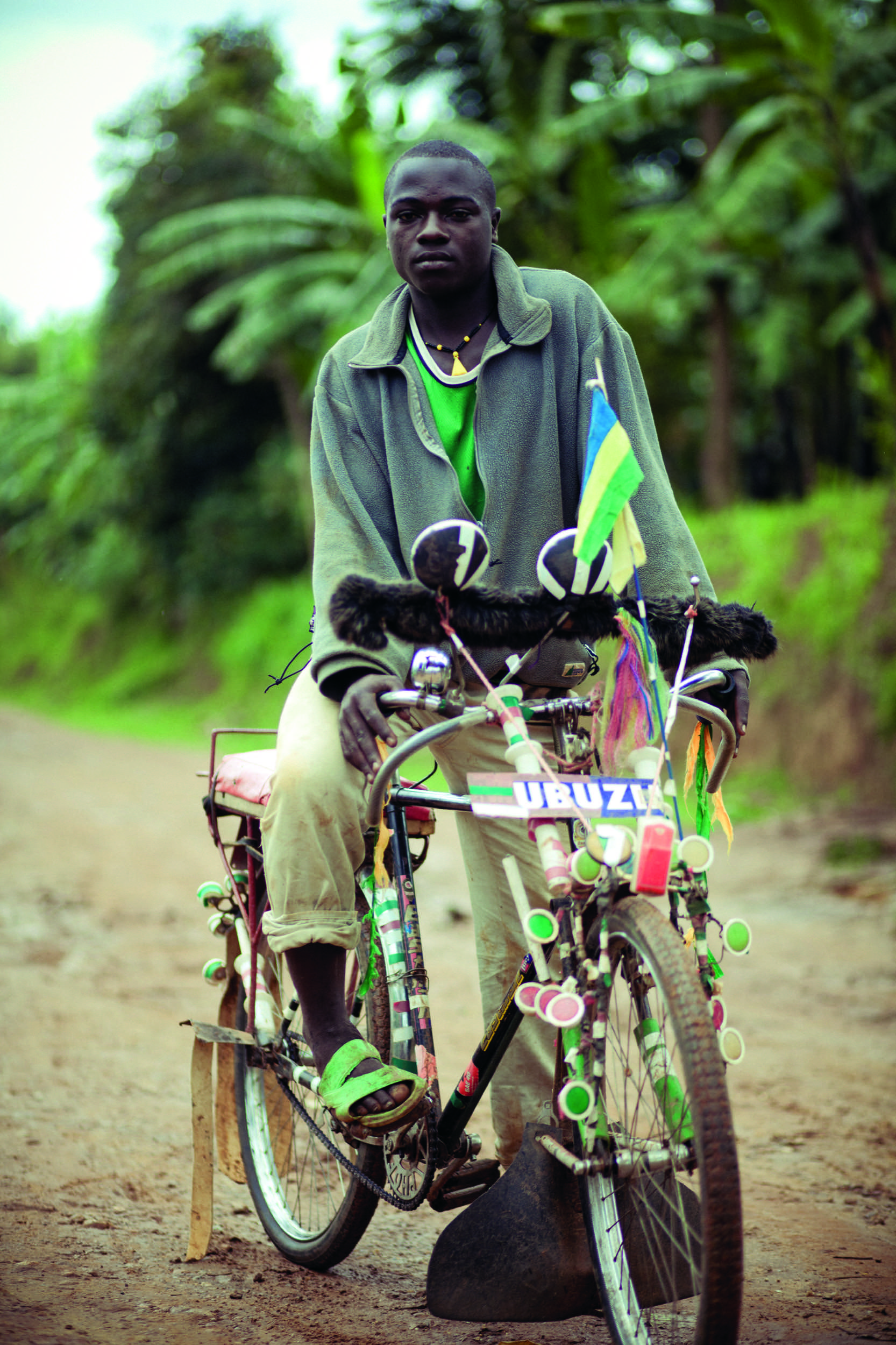 Minawi John, aged 19, on his customised pedicab. Nyamesheke District, Rwanda
