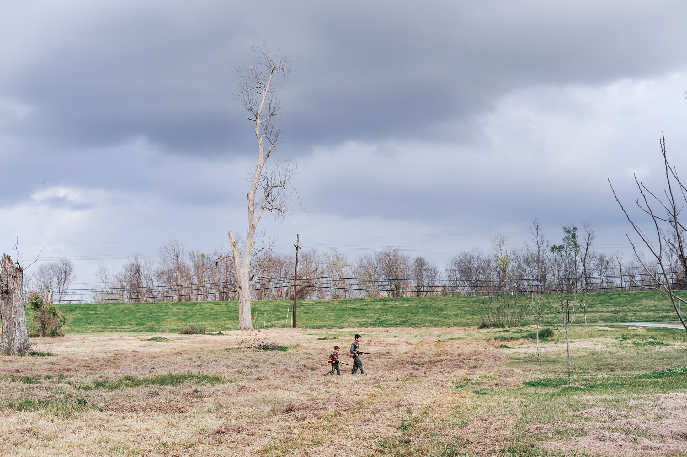 On the outskirts of New Orleans, Louisiana. 2009. Hunting rabbits with BB guns.