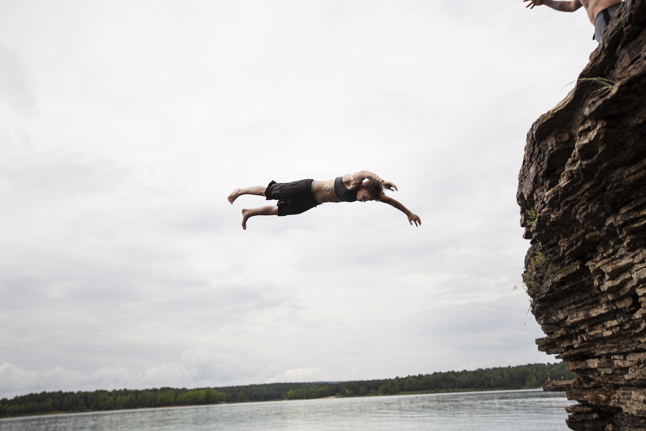 Halea Brown cliff-jumps with a tattoo that reads "Faith" in neighbouring Arkansa.