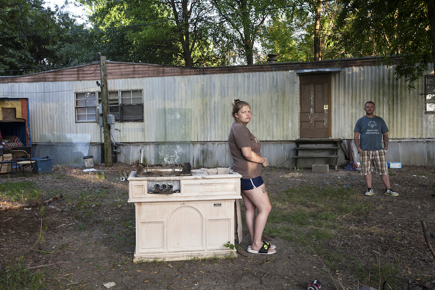 Alaina Brown and her boyfriend, Josh, pose outside their house in Greenville.