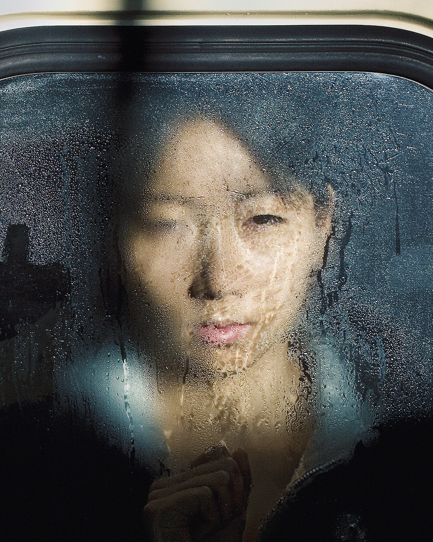 "I like the lady looking directly at me with one eye. It works on several levels: she is looking at me with one eye; I am looking at her with one eye, i.e. my camera lens." - Michael Wolf.