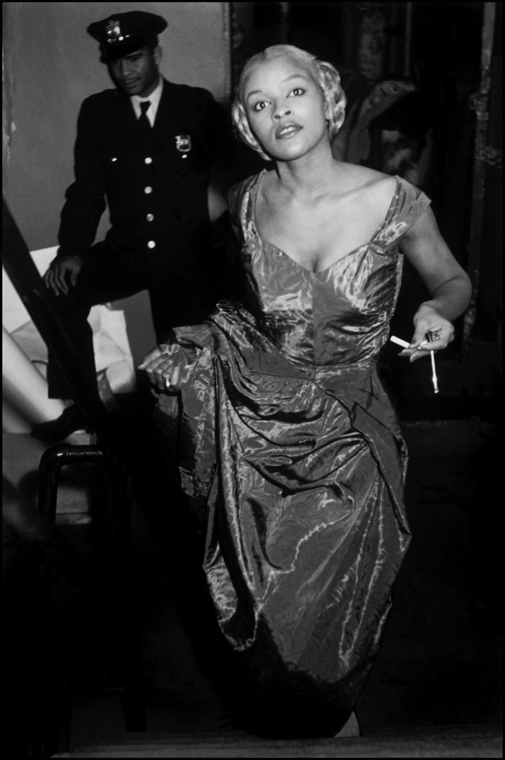 USA. New York City. Fashion in Harlem. Model Charlotte Stribling aka 'Fabulous' waits backstage for the entrance cue to model clothes designed and made in the Harlem community. Photo by Eve Arnold.