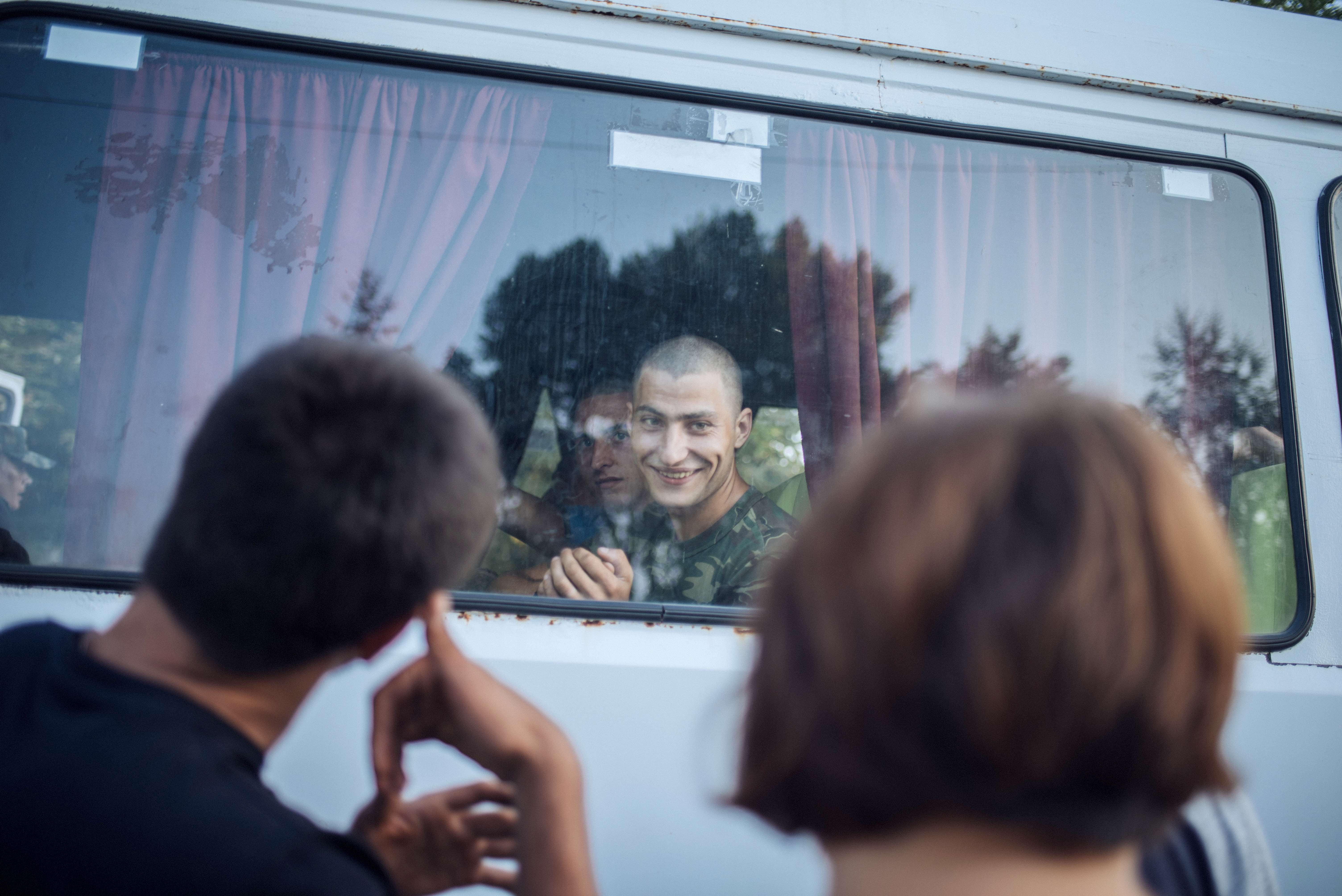 Yura says goodbye to his parents and friends as he leaves for military service. Young men consider the army an indispensable part of their life path. Attending university can postpone recruitment but if you're healthy and under the age of 27, you have to serve.