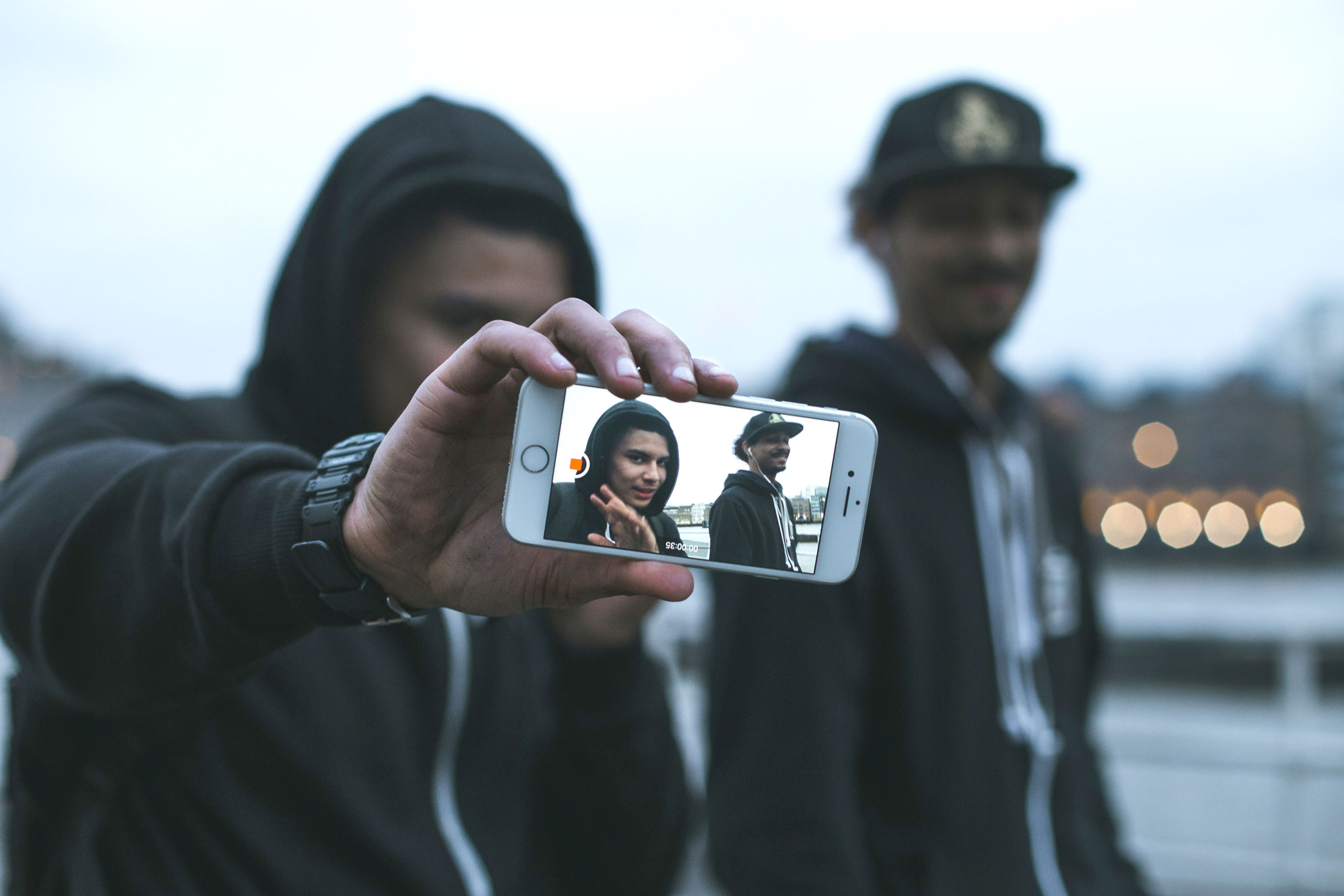 Rian and Kizzy take selfies after a filming session on the banks of the Thames.
