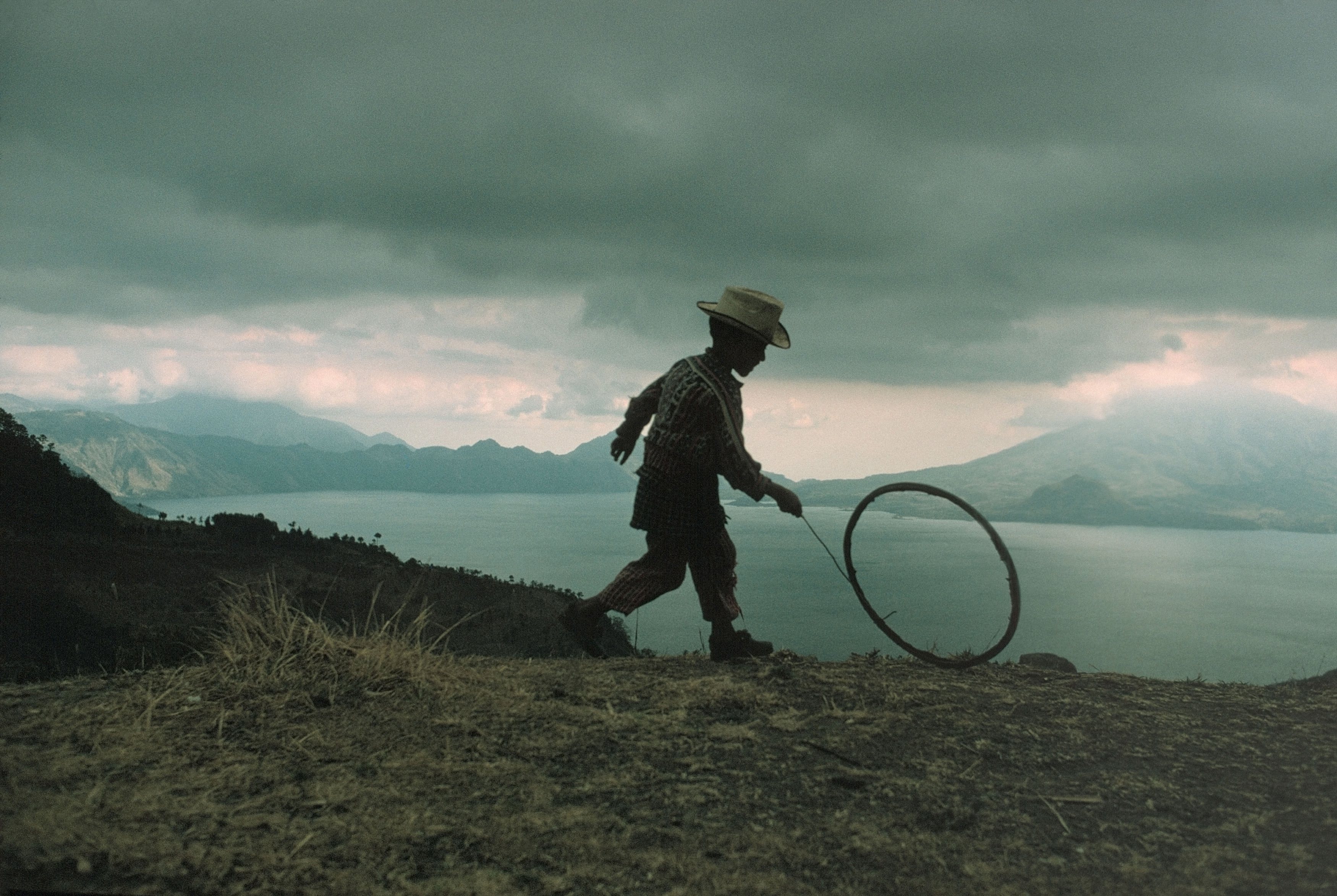 Maya boy plays. Lake Atitlán, in the highlands of Sierra Madre. Guatemala. 1975 © David Alan Harvey / Magnum Photos