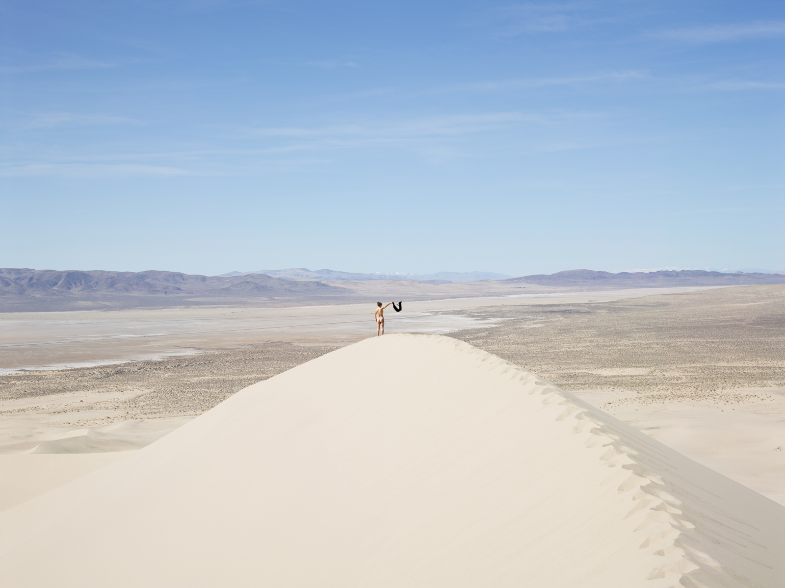 Allie waving to town, Nevada. © Lucas Foglia, courtesy of Michael Hoppen Gallery, London.