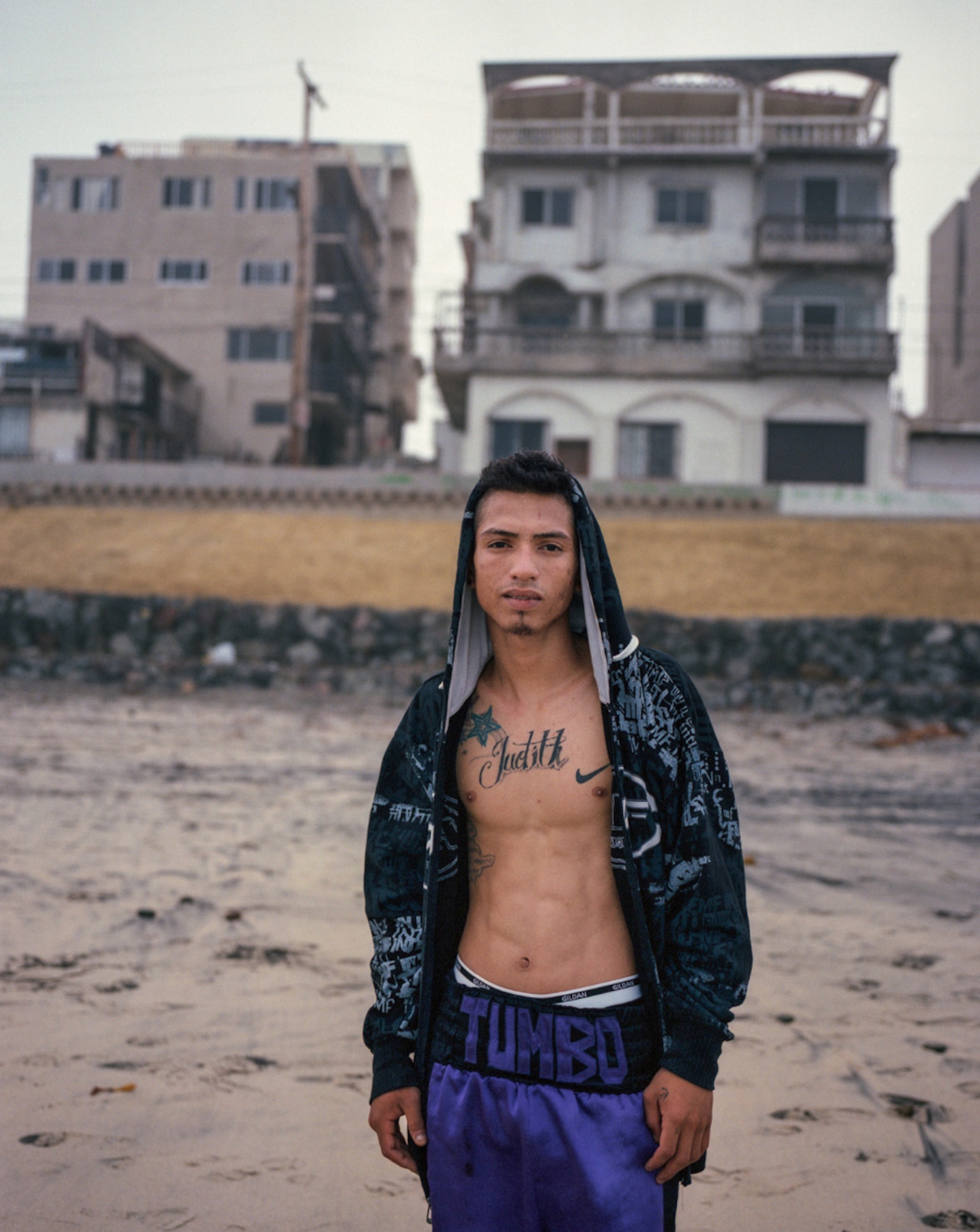 Boxer Javier “El Tumbo” Rios poses for a portrait on the beach in the Playas neighbourhood of Tijuana near the US Mexico border.