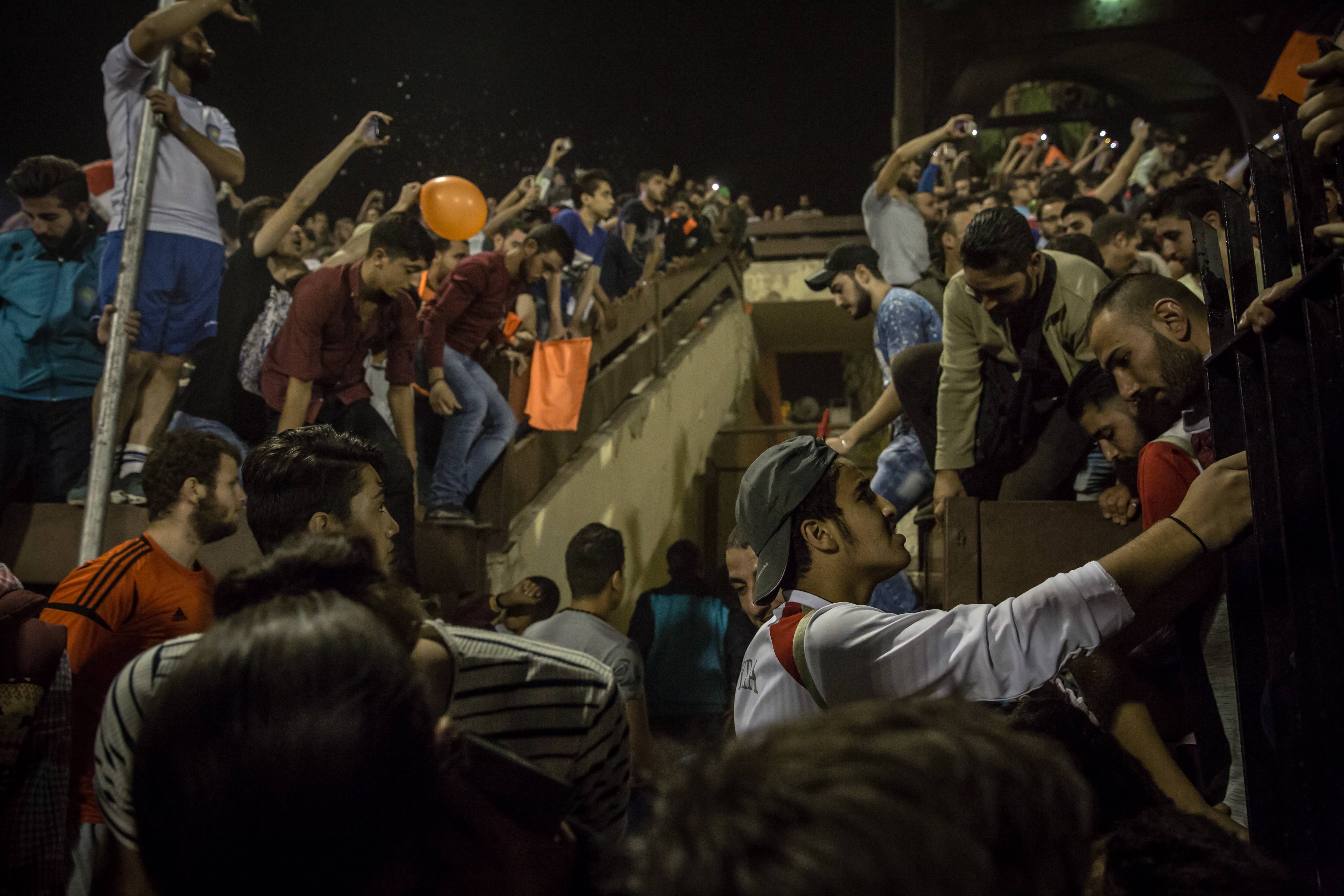 Crowds leave the stands after the Syrian Cup final in Tishreen Stadium, Damascus. There were a few scuffles but nothing major.