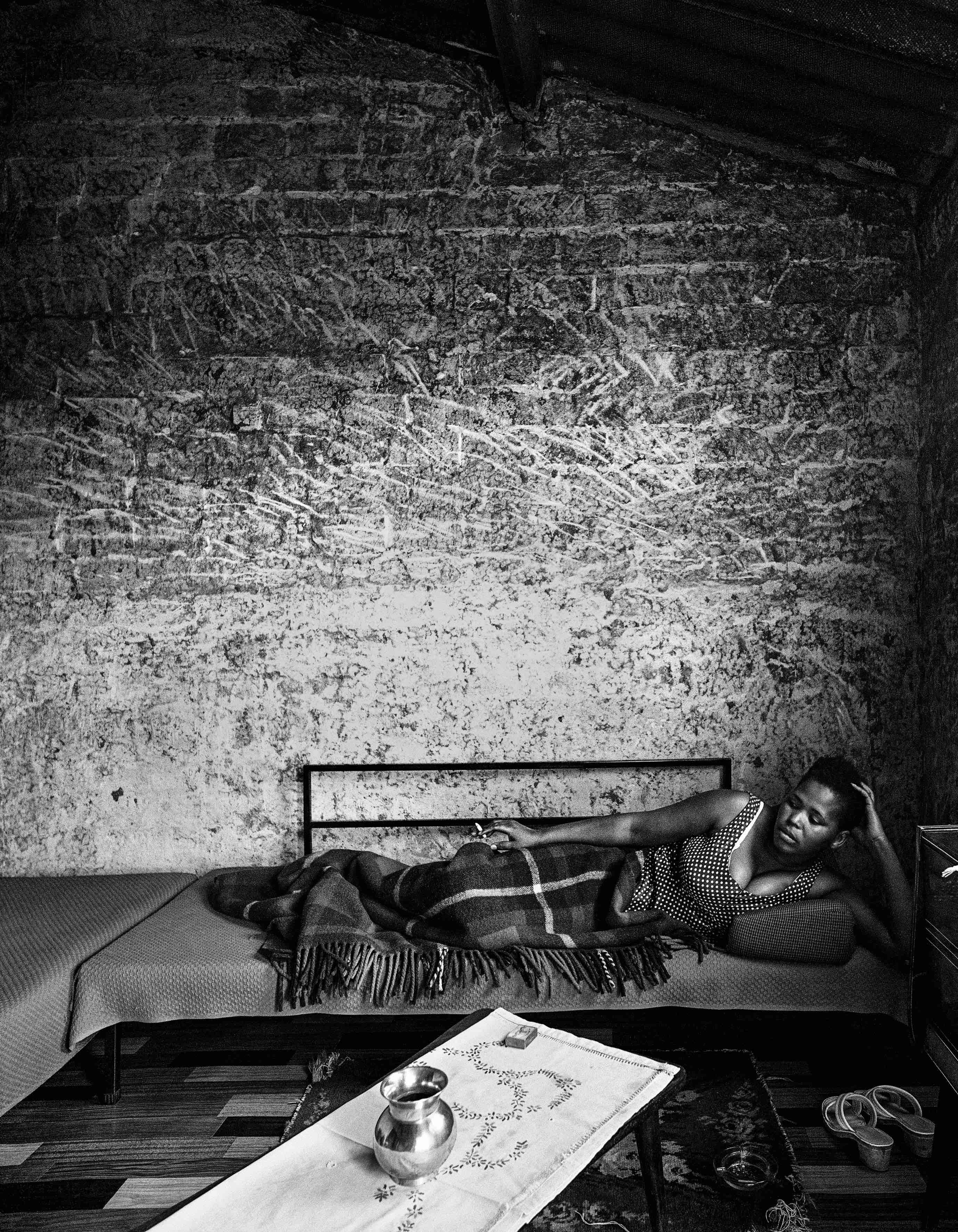 Soweto: Margaret Mcingana at home on a Sunday afternoon, Zola. As Margaret Singana she became a famous singer. She died on 22 April 2000 at the age of 63.