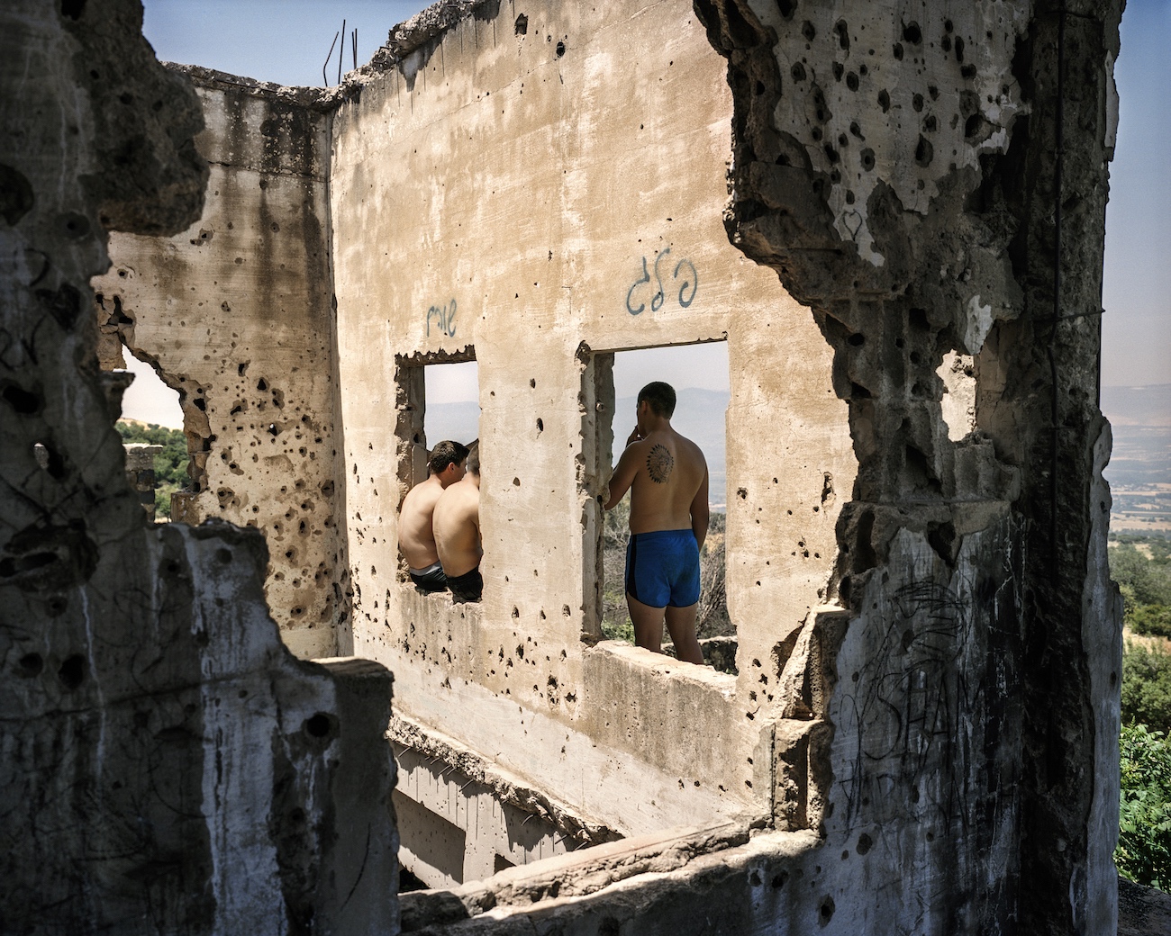 May 13, 2017. Southeast of Kibbutz Snir, Golan Heights. Young Israelis in the ruins of the Syrian village Ain Fit. The village was destroyed in the Six-Day War.