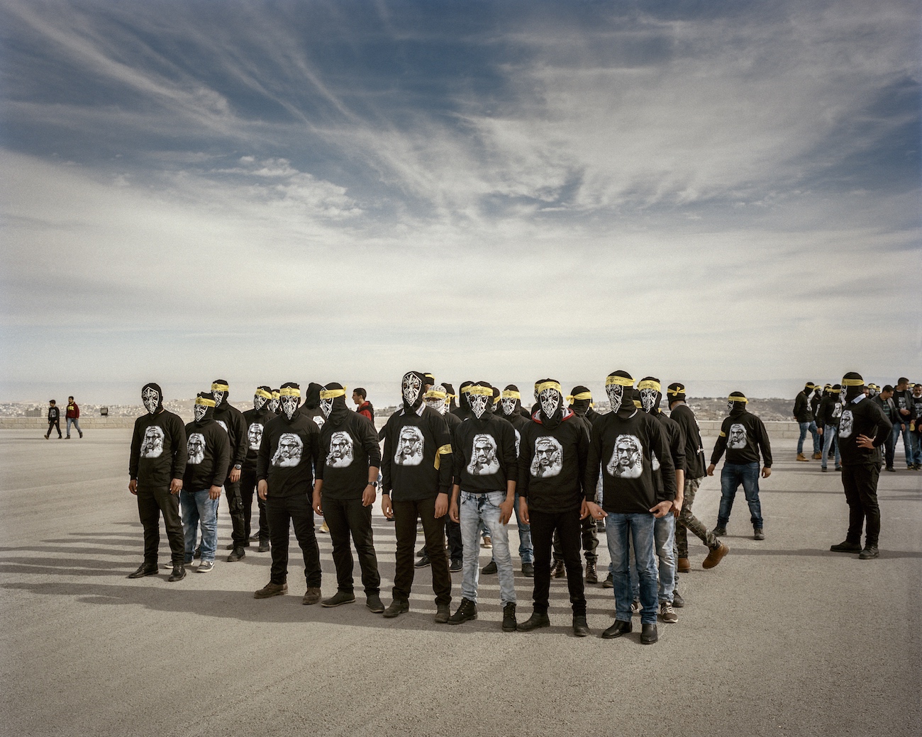 January 7, 2016. Bethlehem, West Bank. Young men move into formation for a march through the city for the 51st anniversary of the Fatah. Yasser Arafat, among others, founded the Fatah in 1959 as a guerilla organisation. It was officially recognised in 1964 with the enacting of a policy statement, which included the stated goals of ‘complete liberation of Palestine,’ and the ‘founding of an independent, democratic state with Jerusalem as capital.’ In 1965 the Fatah began with military operations against Israel, which is why the founding is dated as January 1st of that year.