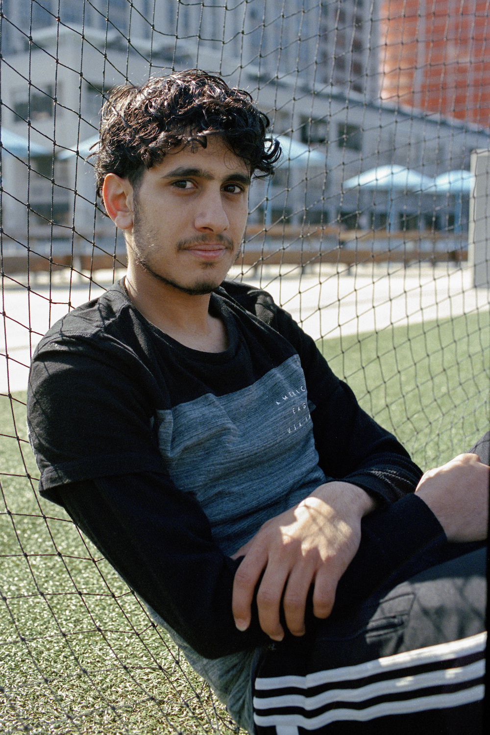 Omar Saleh rests after an early morning training session in Brooklyn Bridge Park.